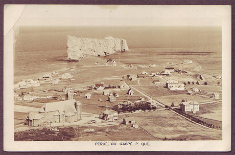 Percé, (Gaspé) Que. Aerial view of the Village and the Rock. Real Photo Postcard ca. 1930.