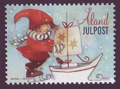 Aland stamp showing child-elf on the ice with toy boat.
